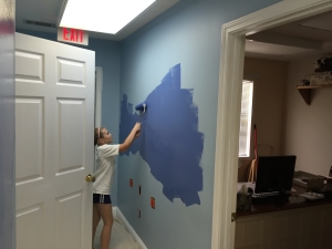 Part of our painting crew hard at work on the hallway.